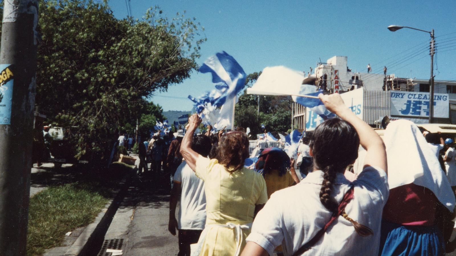 People marching in the streets of San Salvador
